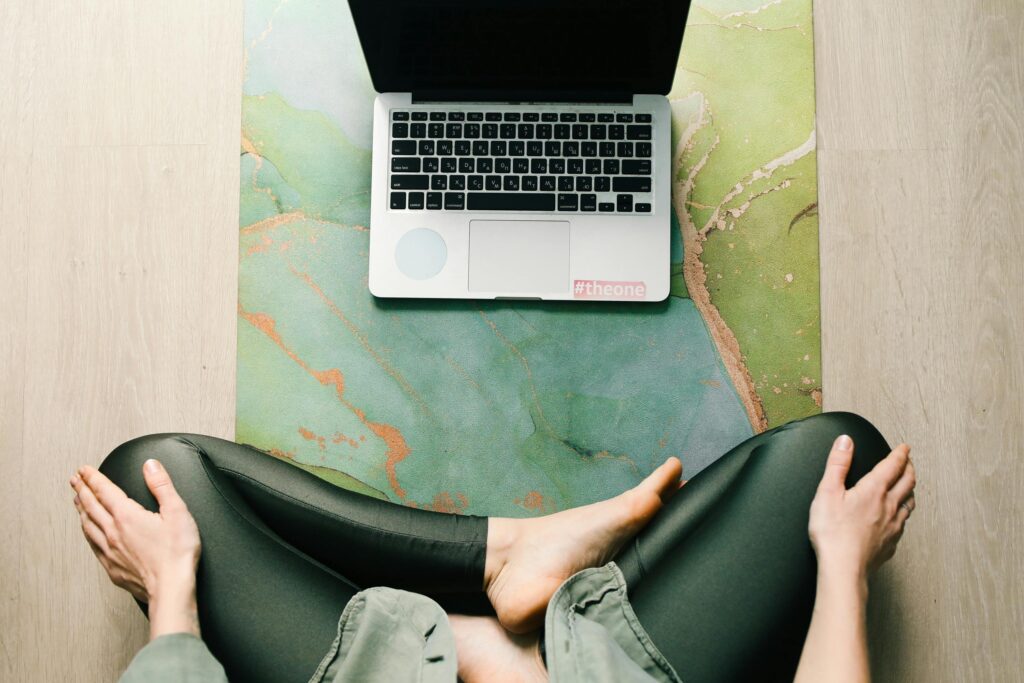 Photo by Polina Tankilevitch: https://www.pexels.com/photo/woman-sitting-on-a-yoga-mat-with-a-laptop-4723339/